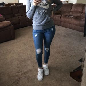 Dark blue distressed jeans